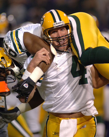 Packers quarterback Brett Favre hoists receiver Greg Jennings